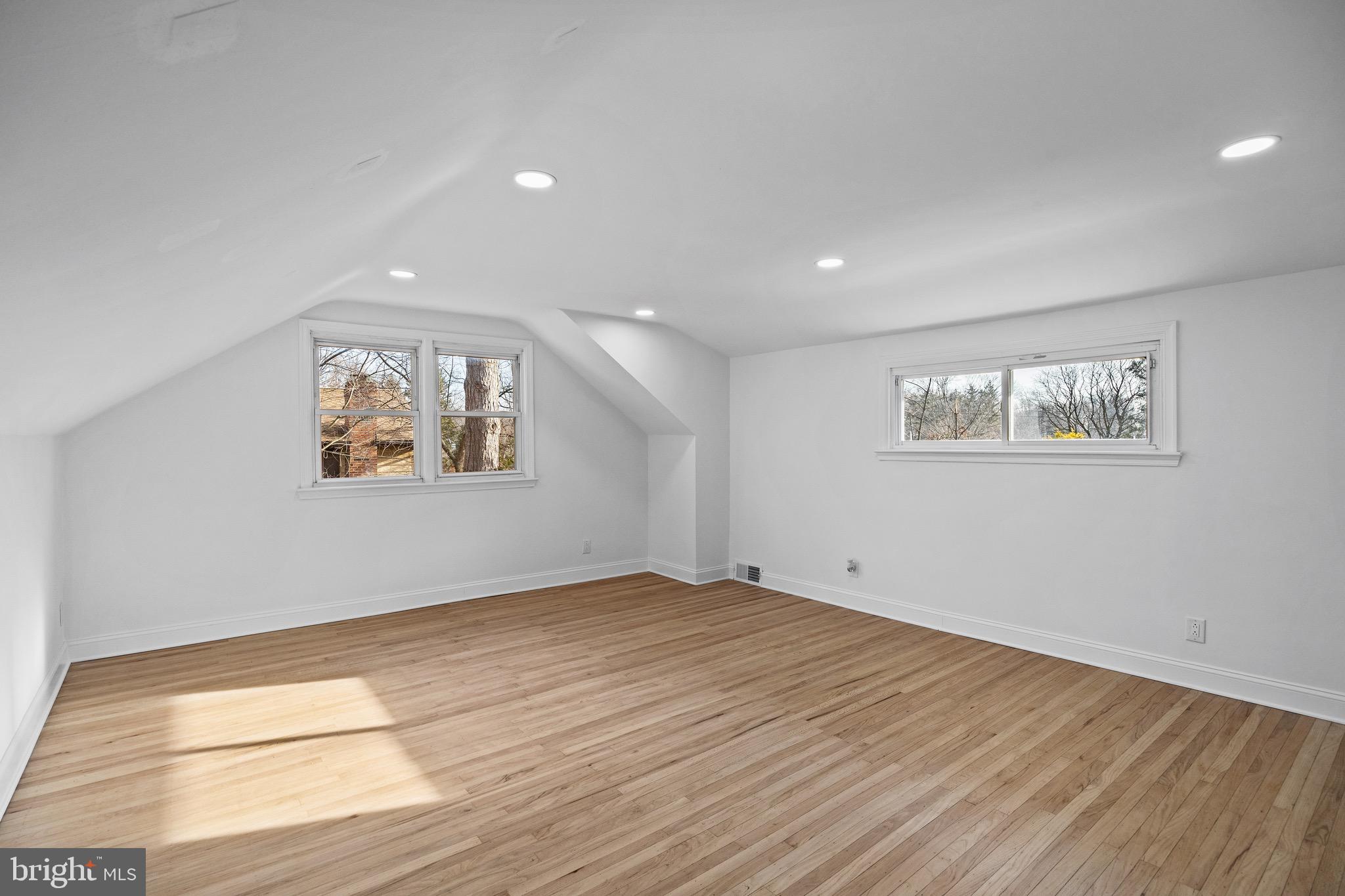 1221 Huntingdon Pike Huntingdon Valley, PA 19006 - Photo 29 of 48 a view of an empty room with wooden floor and a window
