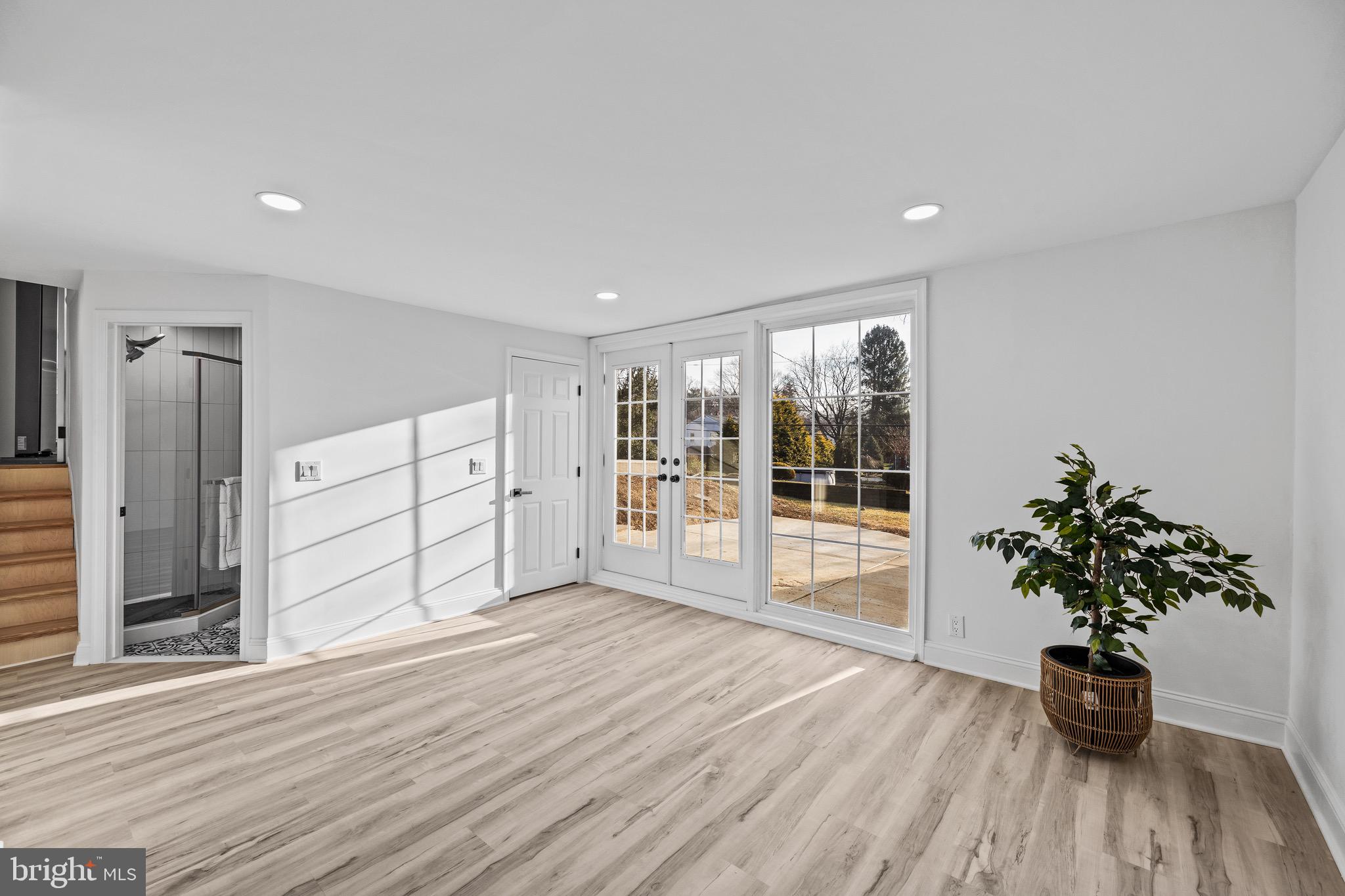 1221 Huntingdon Pike Huntingdon Valley, PA 19006 - Photo 36 of 48 a view of an empty room with wooden floor and a window