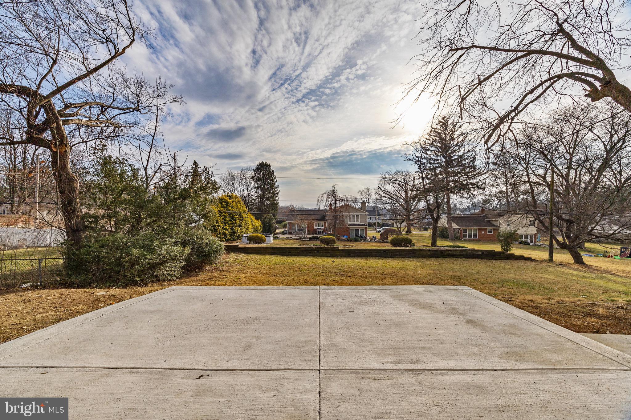1221 Huntingdon Pike Huntingdon Valley, PA 19006 - Photo 42 of 48 a view of yard with swimming pool and trees