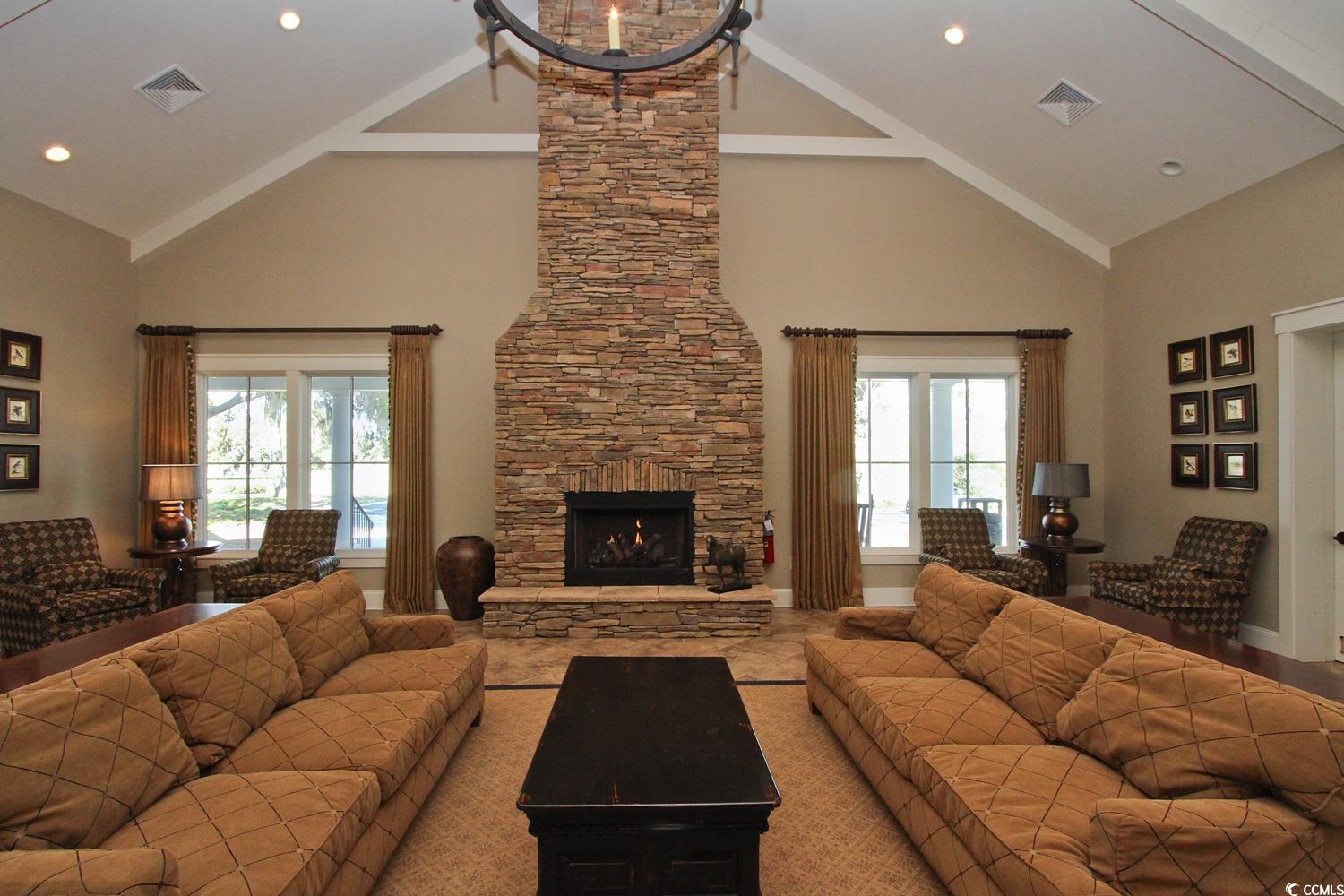 655 Millbrook Road Georgetown, SC 29440 - Photo 11 of 21 Living room featuring a fireplace, high vaulted ce