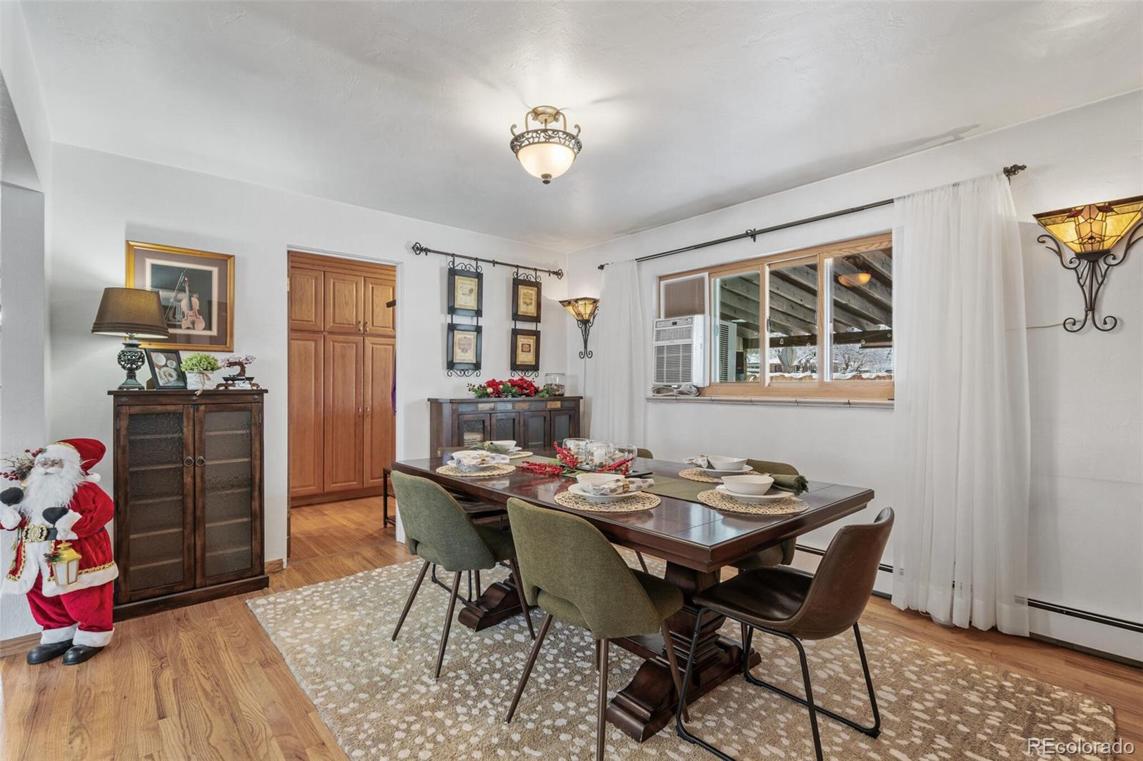 4155 Ingalls Street Wheat Ridge, CO 80033 - Photo 17 of 47 a dining room with furniture and window