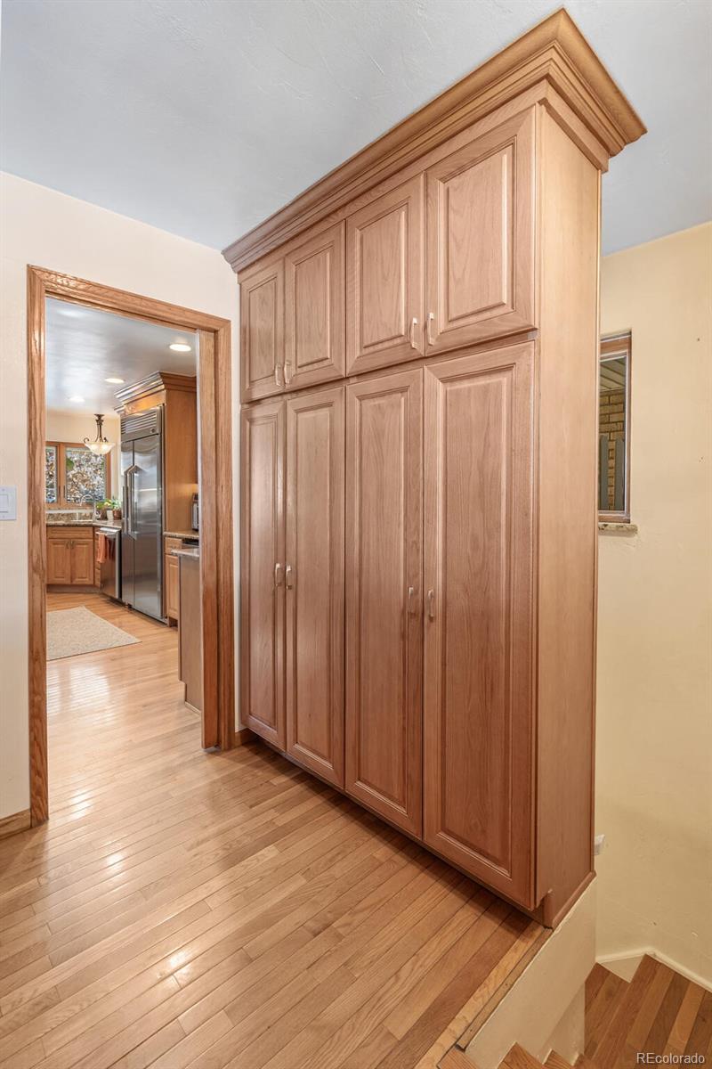 4155 Ingalls Street Wheat Ridge, CO 80033 - Photo 18 of 47 a view of a livingroom with wooden floor and furniture