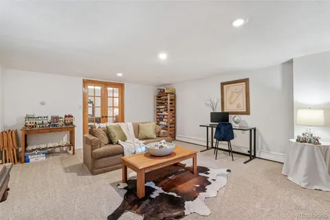 a bedroom with furniture and a book shelf