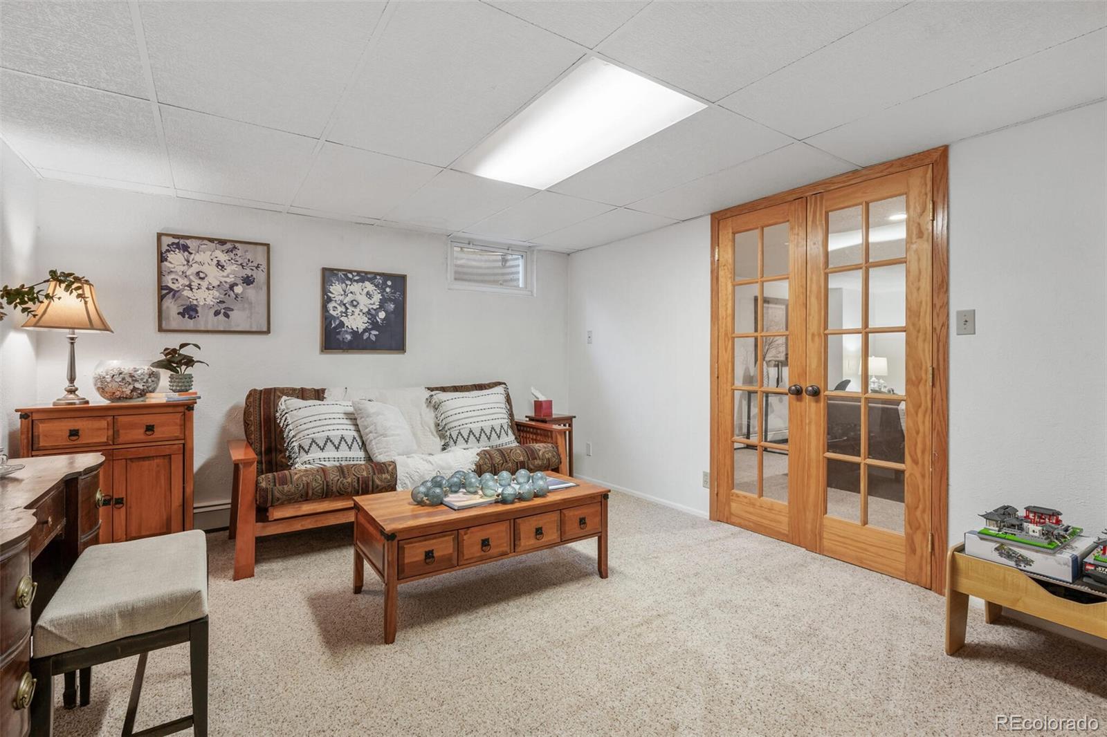 4155 Ingalls Street Wheat Ridge, CO 80033 - Photo 27 of 47 a living room with furniture and a window