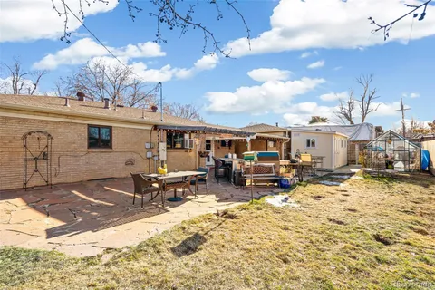 a view of a chairs and tables in patio