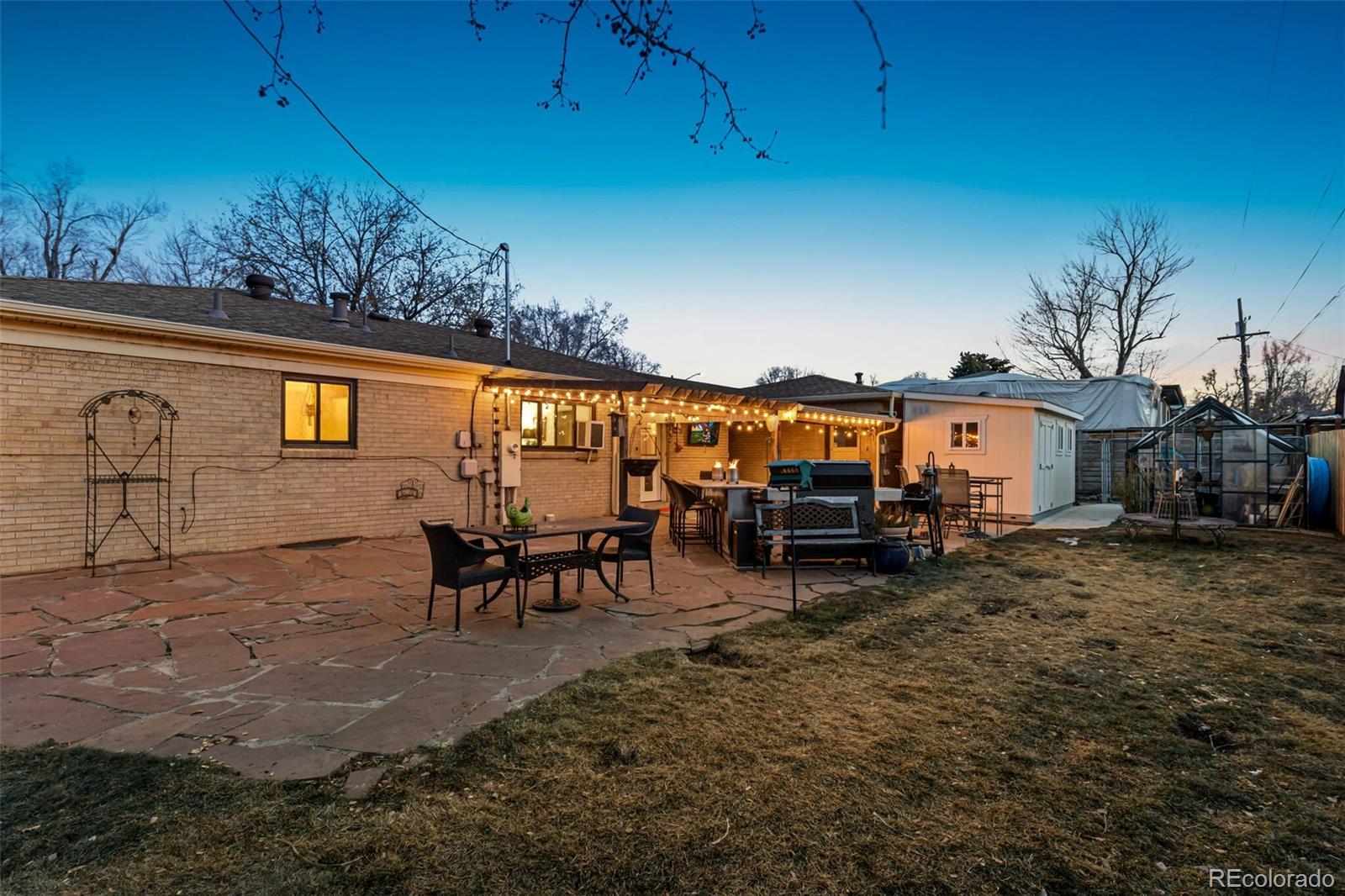 4155 Ingalls Street Wheat Ridge, CO 80033 - Photo 34 of 47 a view of a chairs and tables in patio