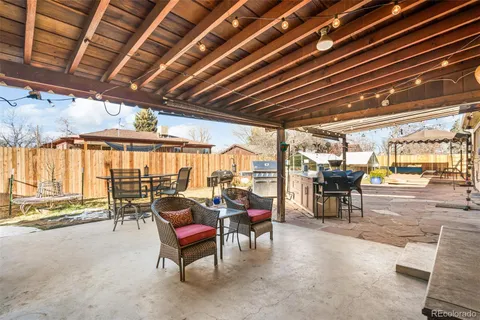 a view of a chairs and table in a patio