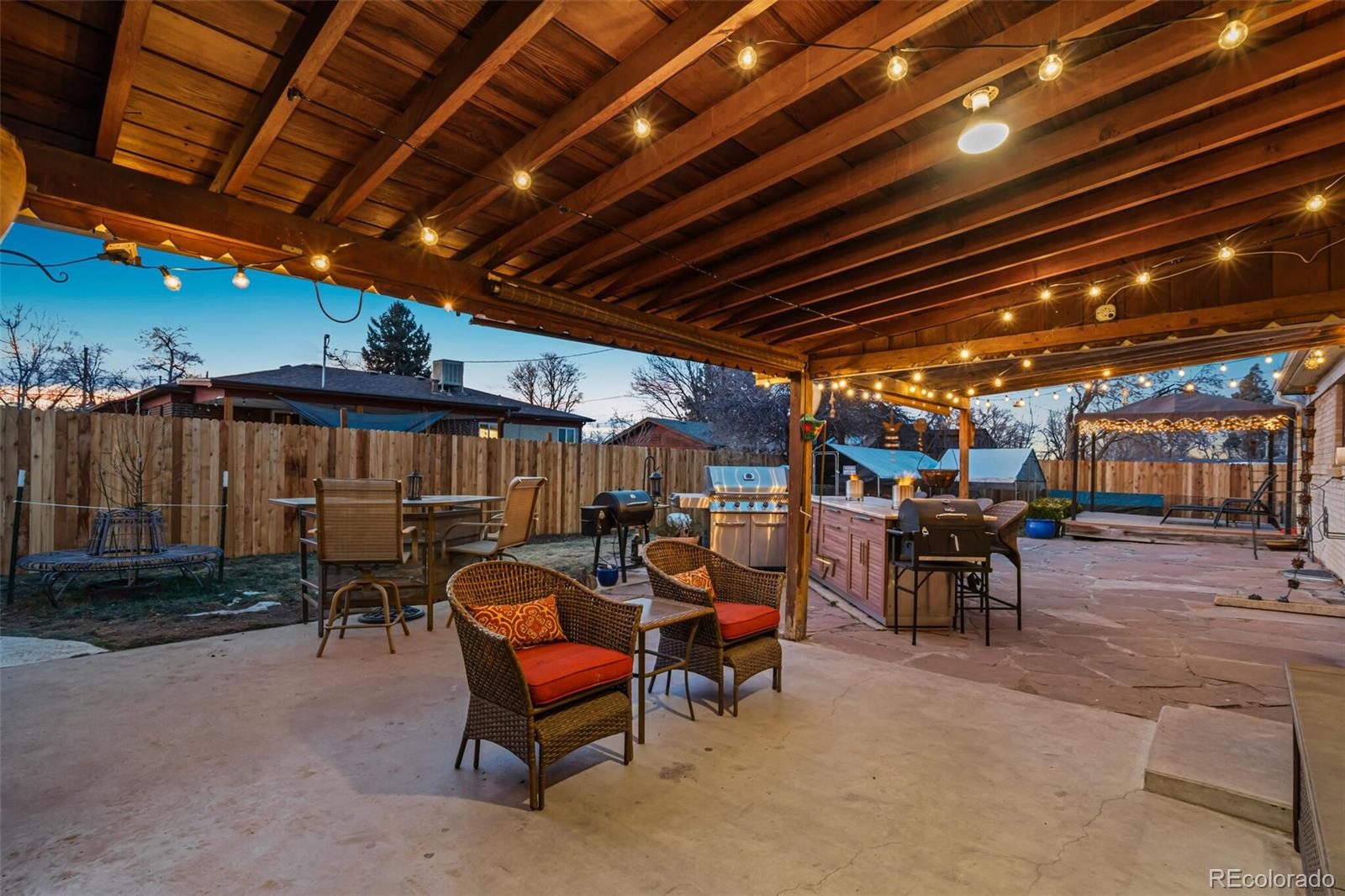 4155 Ingalls Street Wheat Ridge, CO 80033 - Photo 39 of 47 a view of a chairs and table in a patio