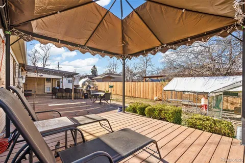 a view of a backyard with sitting area