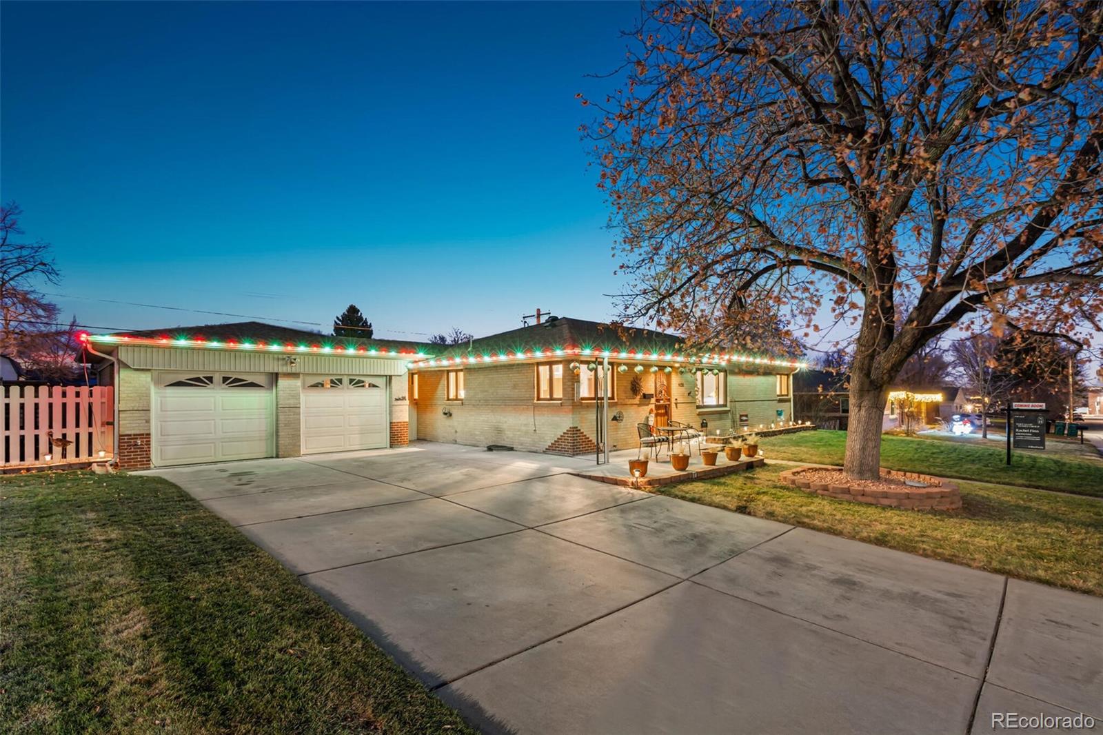 4155 Ingalls Street Wheat Ridge, CO 80033 - Photo 4 of 47 a view of a yard with plants and large trees
