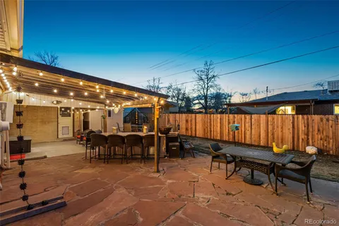 a view of a patio with a table and chairs