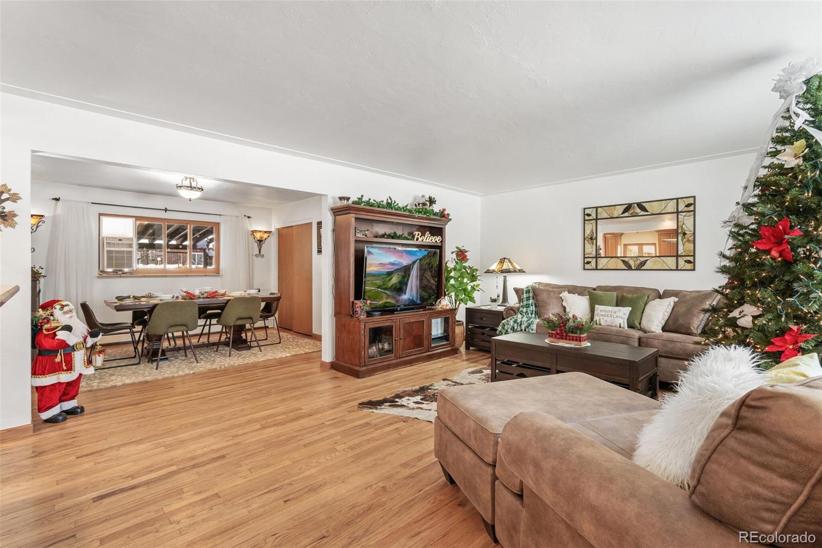 4155 Ingalls Street Wheat Ridge, CO 80033 - Photo 5 of 47 a living room with furniture and a flat screen tv