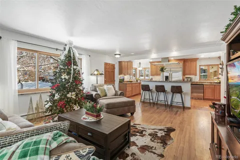 a kitchen with sink and chairs