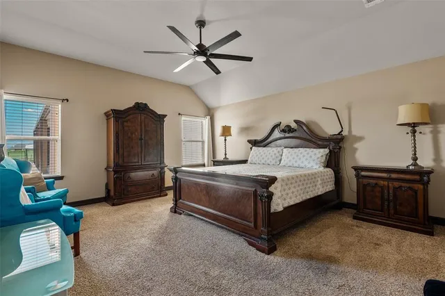 a bathroom with a granite countertop sink a mirror and shower