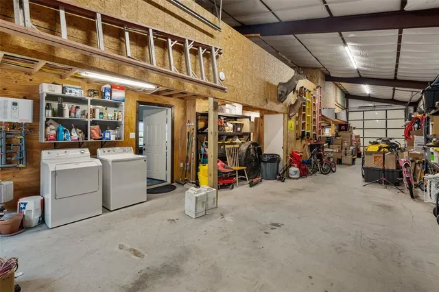 an aerial view of a house with big yard
