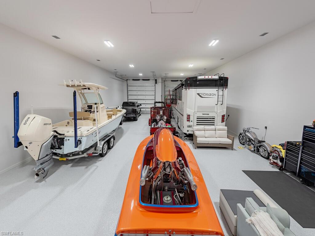 6824 Sable Ridge Lane Naples, FL 34109 - Photo 24 of 36 a view of a room with gym equipment