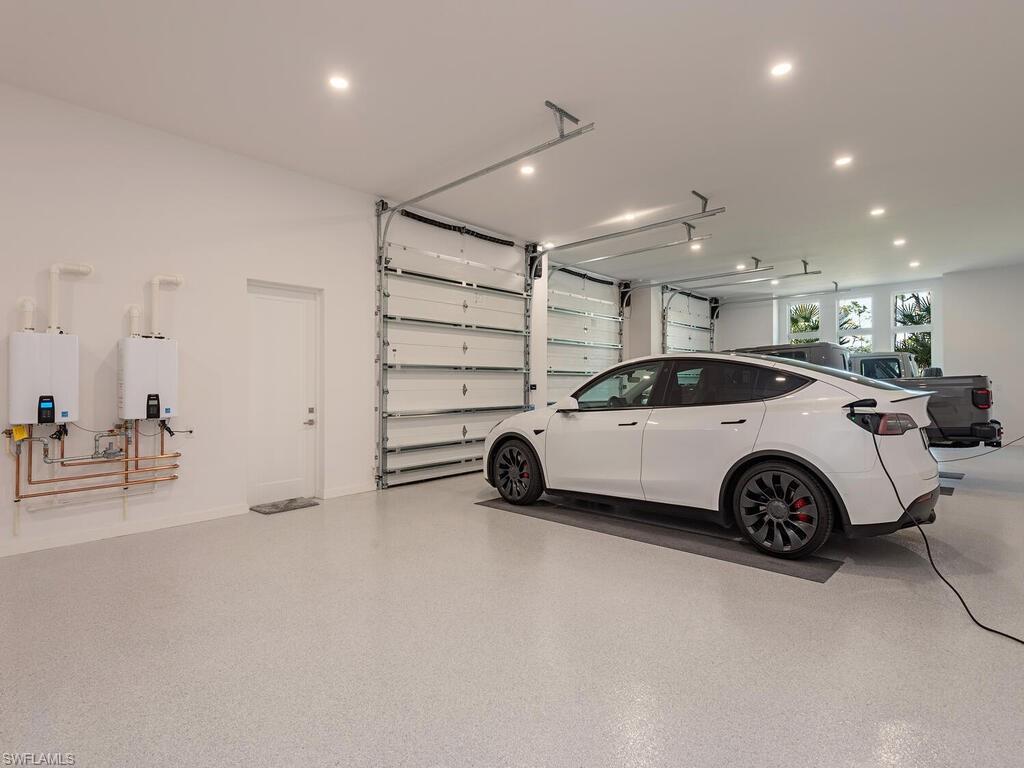 6824 Sable Ridge Lane Naples, FL 34109 - Photo 25 of 36 a view of a car in garage