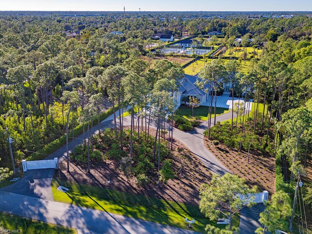 6824 Sable Ridge Lane Naples, FL 34109 - Photo 30 of 36 an aerial view of residential houses with outdoor space