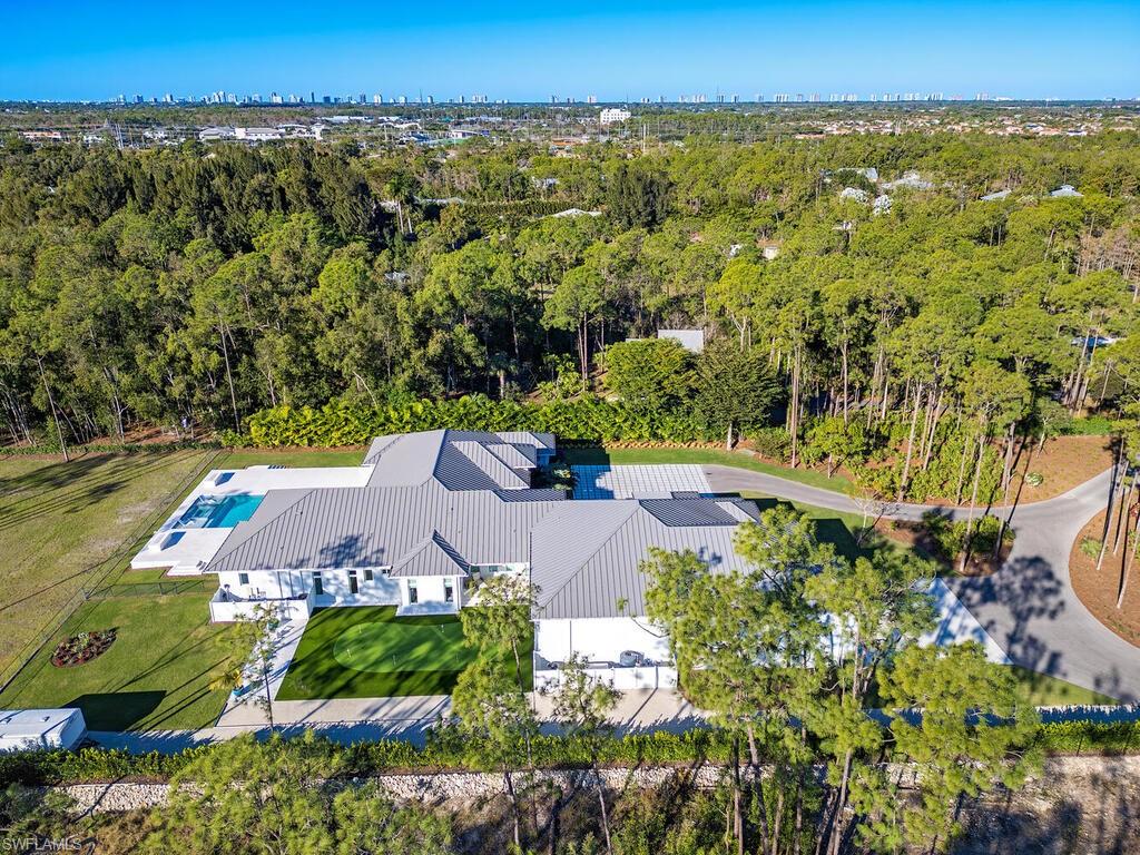 6824 Sable Ridge Lane Naples, FL 34109 - Photo 31 of 36 an aerial view of a house with a yard