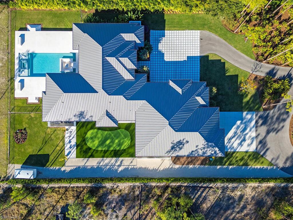 6824 Sable Ridge Lane Naples, FL 34109 - Photo 32 of 36 an aerial view of a house with garden