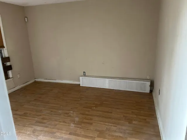 a view of an front door and wooden floor