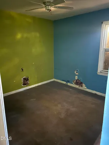 a bathroom with a glass door and mirror