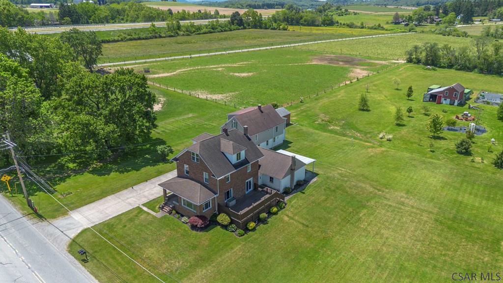915 Miller Picking Road Davidsville, PA 15928 - Photo 2 of 30 a view of a golf course with chairs
