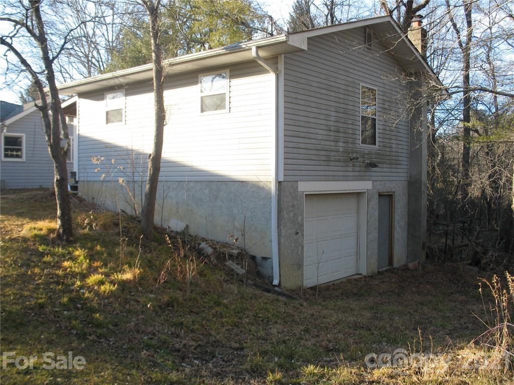 2060 Ridge Road Hendersonville, NC 28792 - Photo 17 of 21 a view of a house with a yard