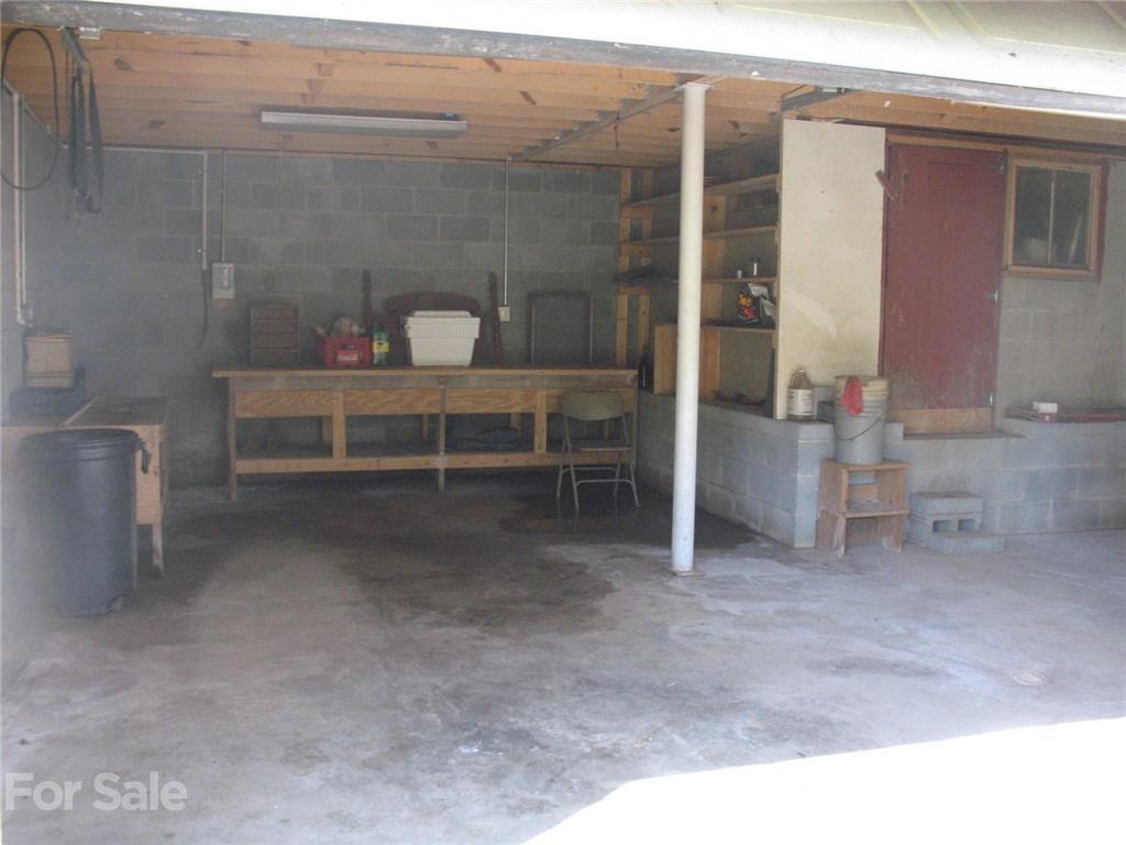 2060 Ridge Road Hendersonville, NC 28792 - Photo 19 of 21 a view of a room with shelves