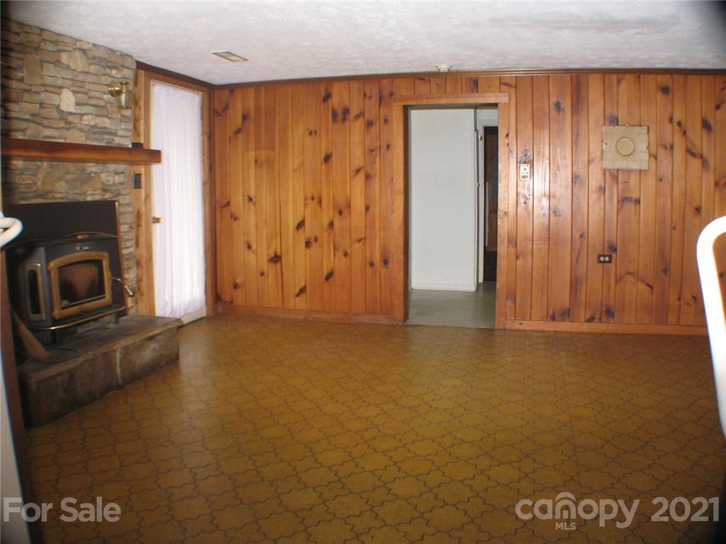 2060 Ridge Road Hendersonville, NC 28792 - Photo 3 of 21 a view of a livingroom with an empty space and a fireplace