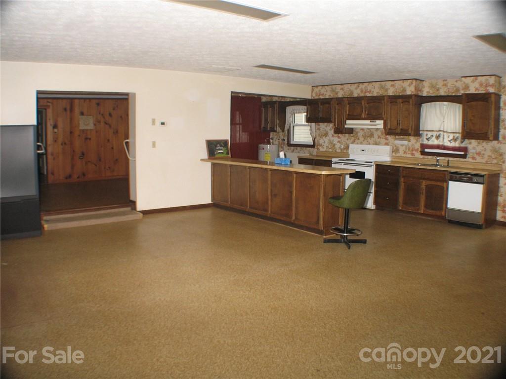 2060 Ridge Road Hendersonville, NC 28792 - Photo 8 of 21 a kitchen with a refrigerator and counter space