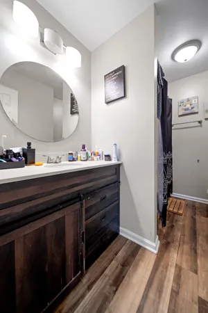 a bathroom with a sink and a mirror