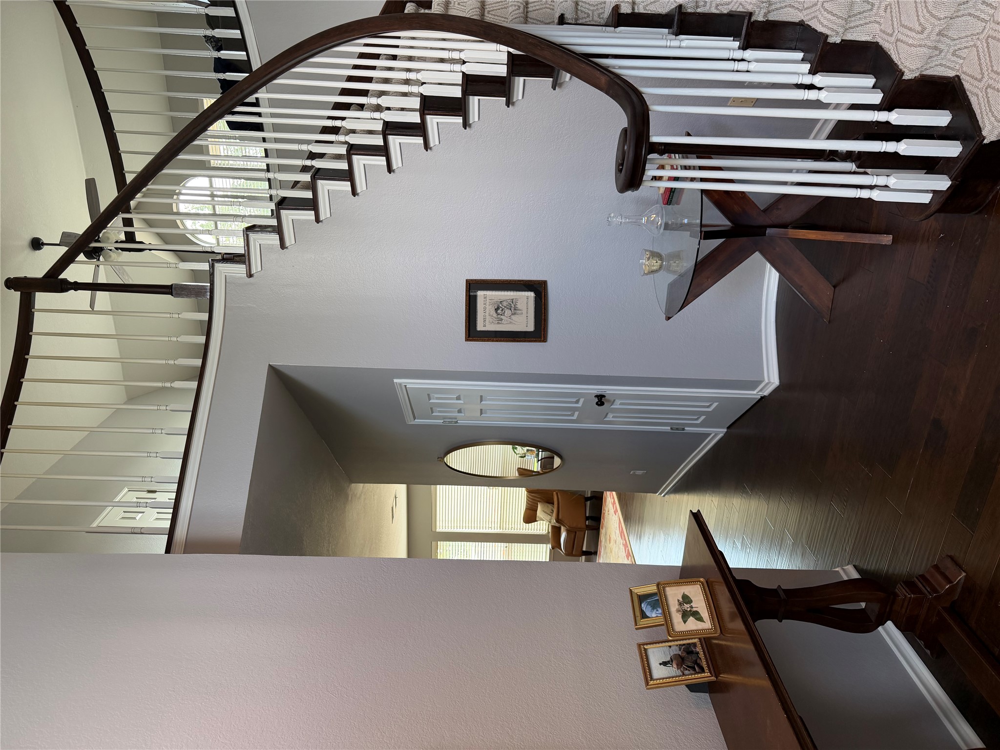 13 Oak View Round Rock, TX 78664 - Photo 6 of 30 A grand curved staircase with rich wood and white balusters defines this elegant entry.