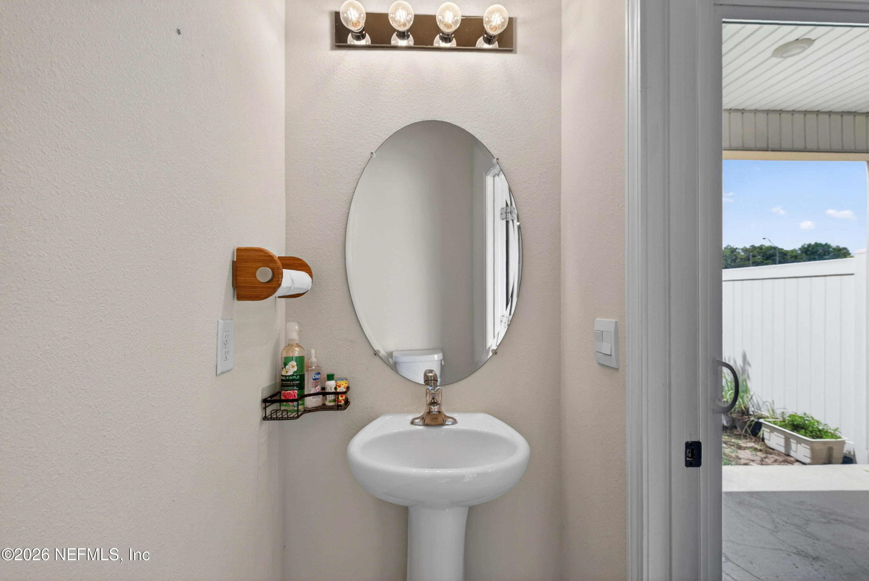 8210 Larose Road Jacksonville, FL 32211 - Photo 15 of 38 a bathroom with a sink and a mirror