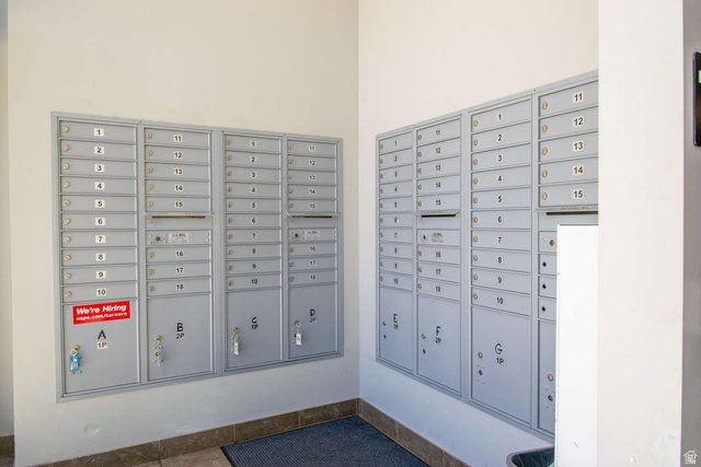 4276 South Main Street, Unit 303 Murray, UT 84107 - Photo 17 of 20 Secure, wall-mounted mailboxes featuring individual compartments and parcel lockers