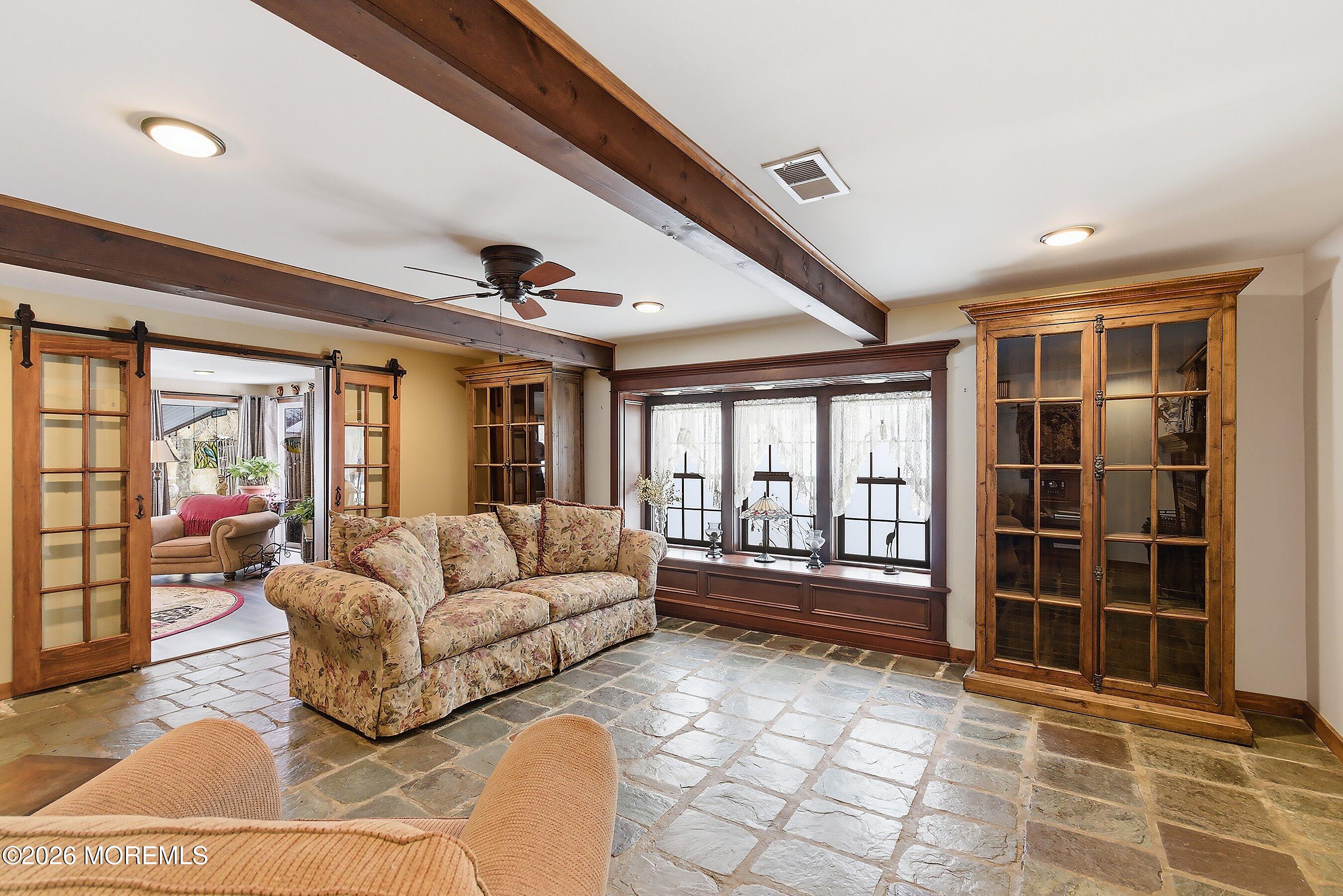 515 Carroll Fox Road Brick, NJ 08724 - Photo 27 of 60 a living room with furniture and a large window