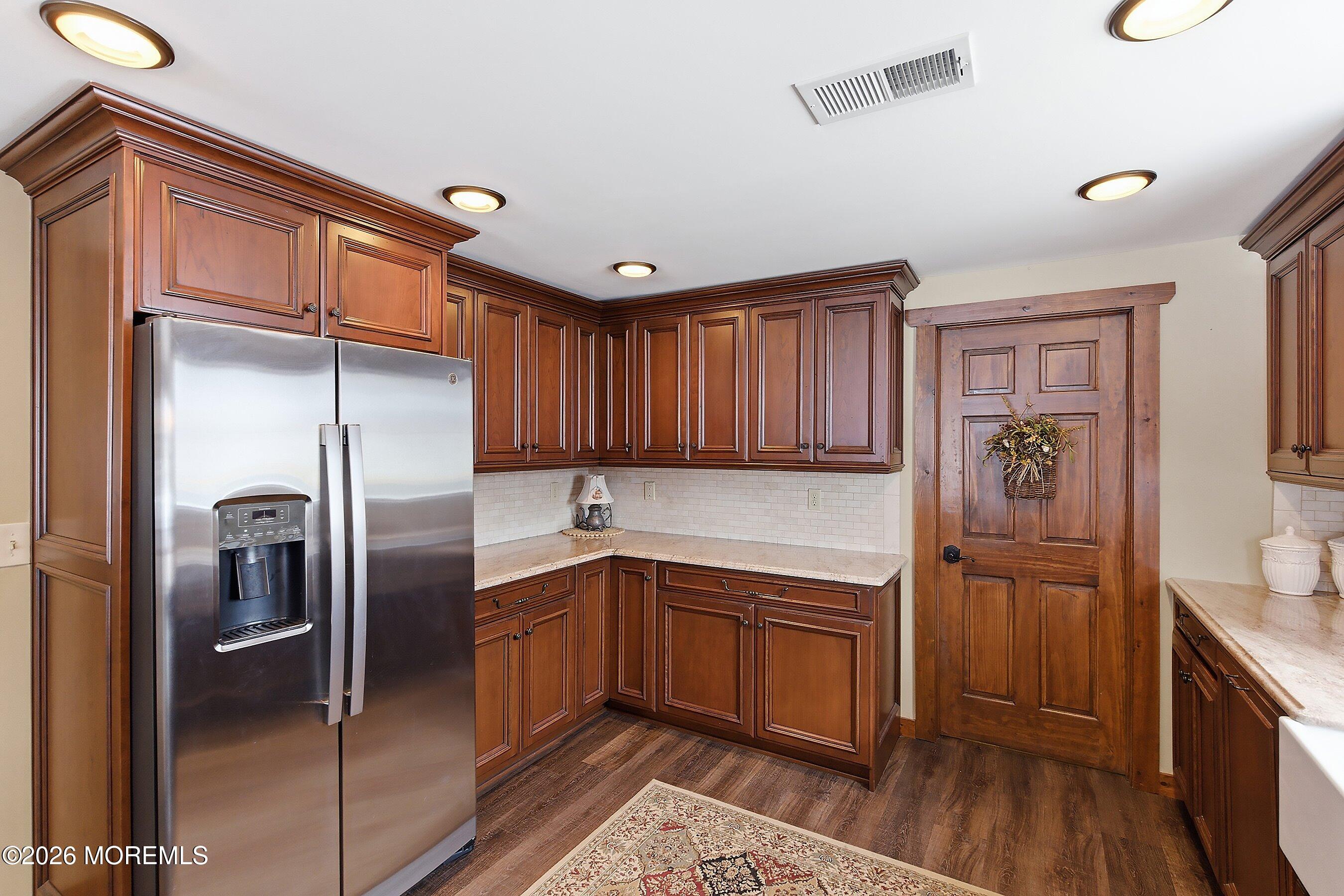 515 Carroll Fox Road Brick, NJ 08724 - Photo 35 of 60 a kitchen with a refrigerator sink and cabinets