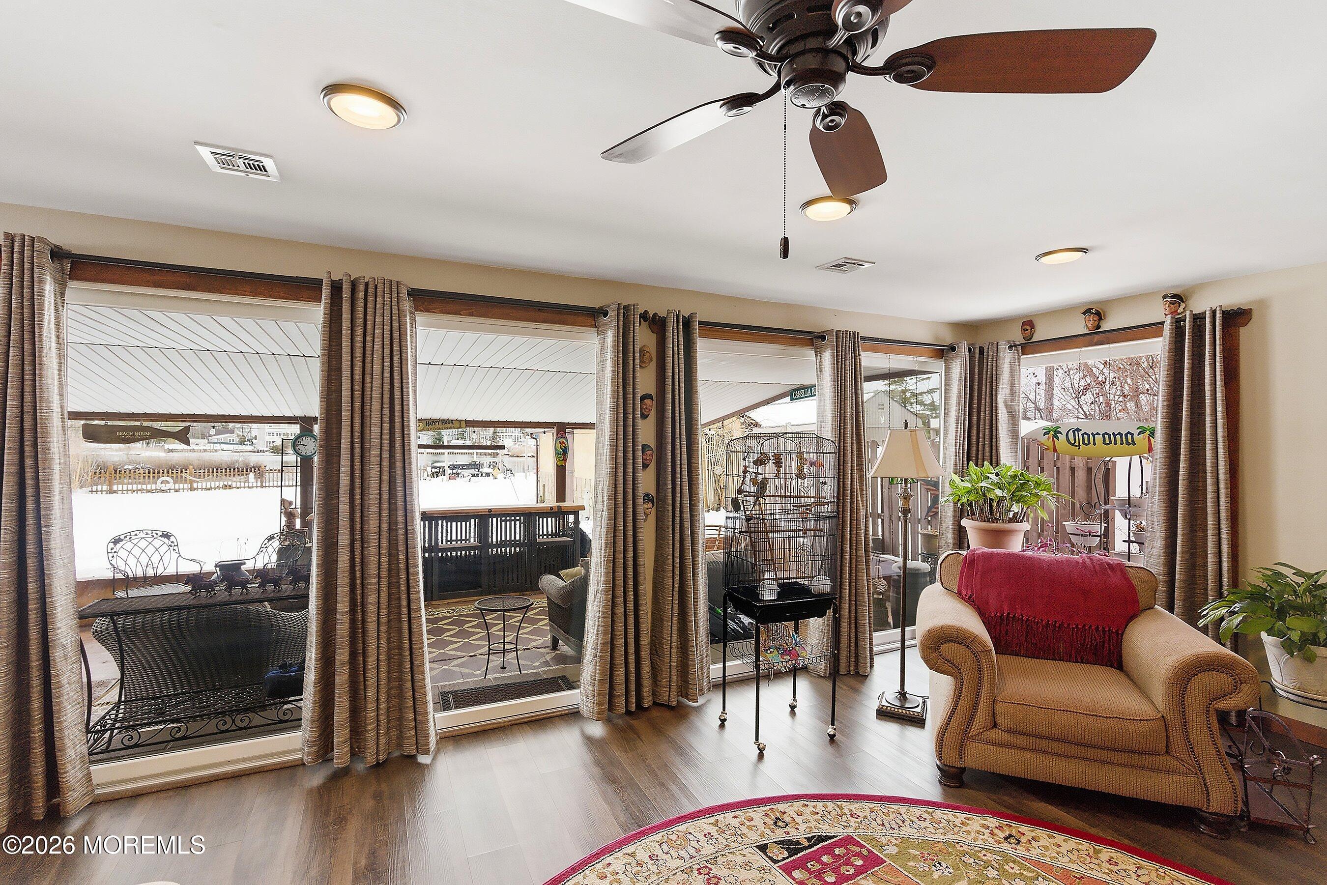 515 Carroll Fox Road Brick, NJ 08724 - Photo 49 of 60 a living room with furniture and a floor to ceiling window