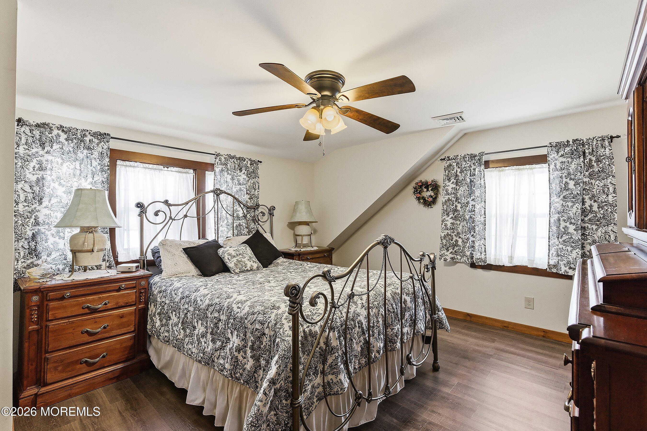 515 Carroll Fox Road Brick, NJ 08724 - Photo 59 of 60 a bedroom with a bed and a chandelier