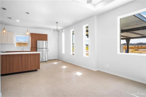 a view of a kitchen with a sink and cabinets