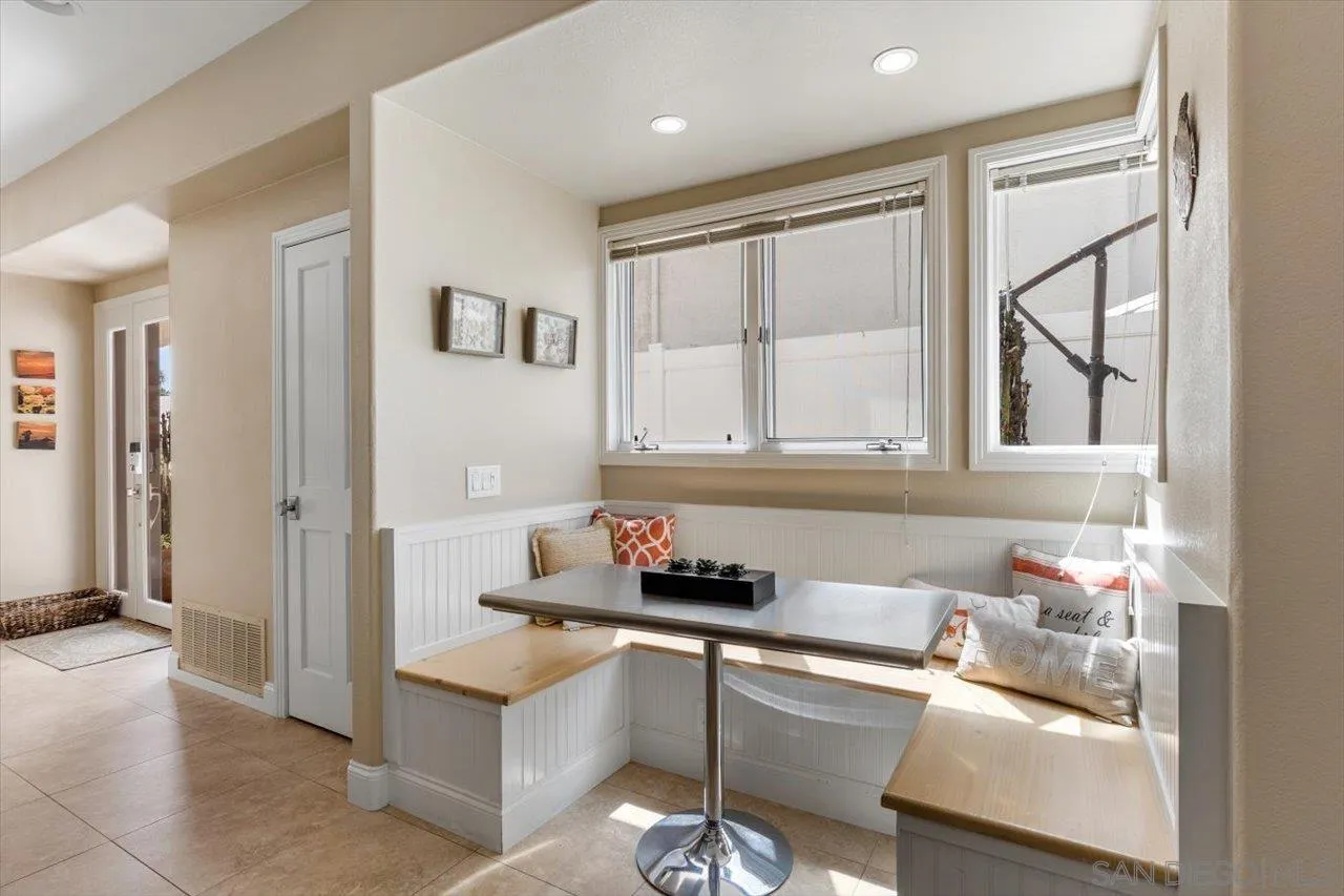 312 Bonair Street La Jolla, CA 92037 - Photo 13 of 40 a kitchen with granite countertop a sink and a refrigerator