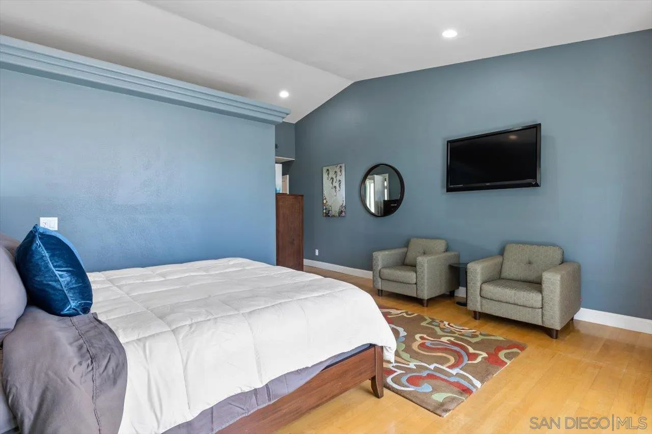 312 Bonair Street La Jolla, CA 92037 - Photo 15 of 40 a bedroom with bed and a couch