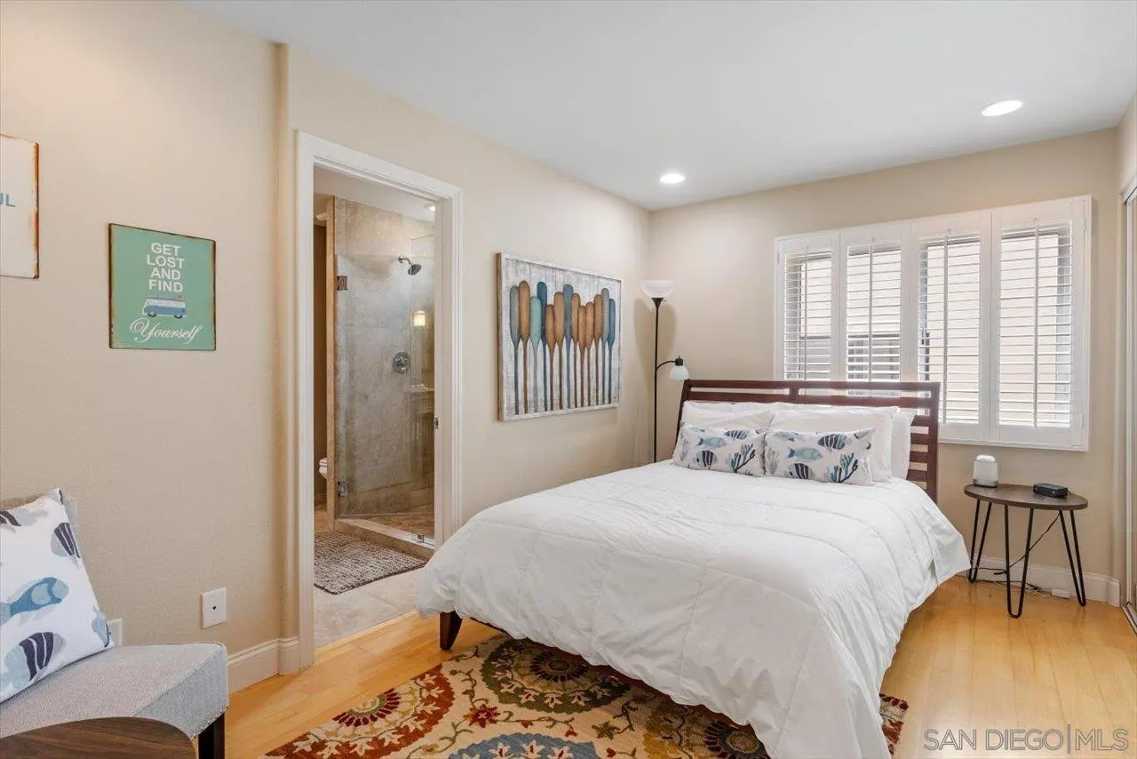 312 Bonair Street La Jolla, CA 92037 - Photo 19 of 40 a bedroom with a bed and a couch