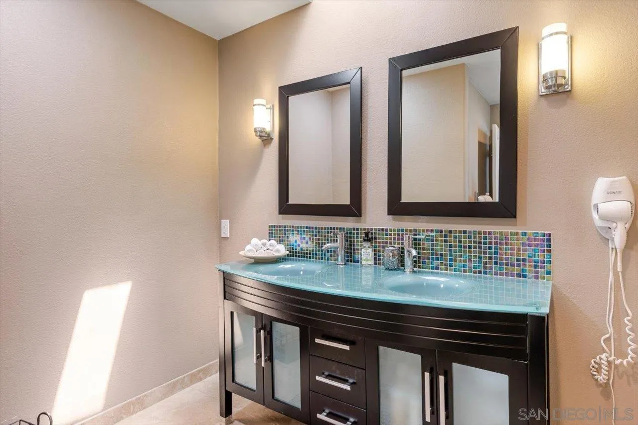 312 Bonair Street La Jolla, CA 92037 - Photo 20 of 40 a bathroom with a sink and a mirror