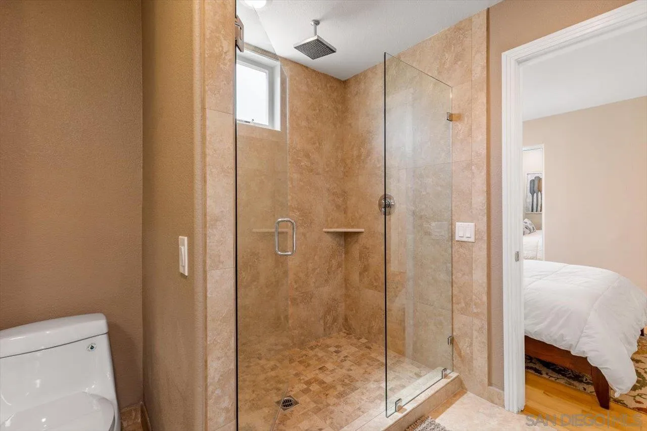 312 Bonair Street La Jolla, CA 92037 - Photo 21 of 40 a bathroom with a shower and toilet