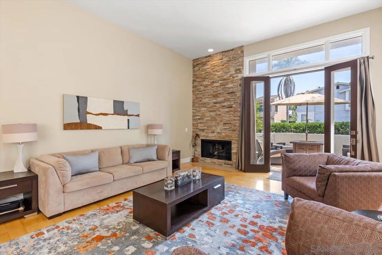 312 Bonair Street La Jolla, CA 92037 - Photo 3 of 40 a living room with furniture fireplace and a large window