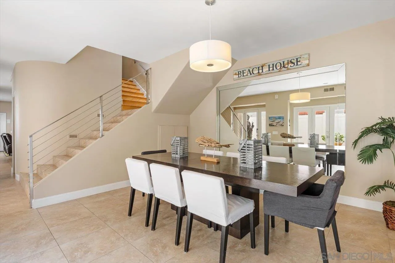 312 Bonair Street La Jolla, CA 92037 - Photo 6 of 40 a dining room with furniture and a chandelier