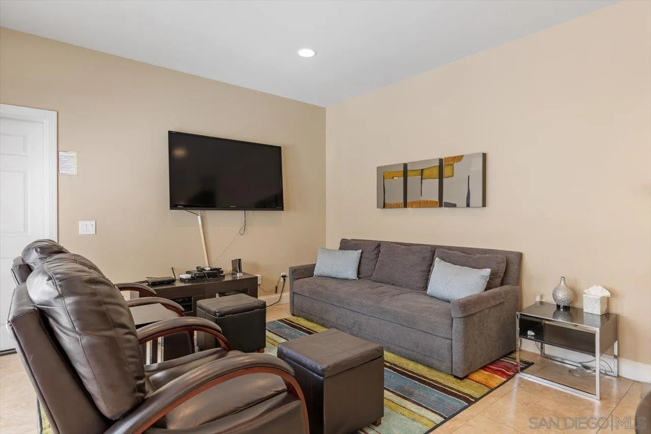 312 Bonair Street La Jolla, CA 92037 - Photo 7 of 40 a living room with furniture and a flat screen tv