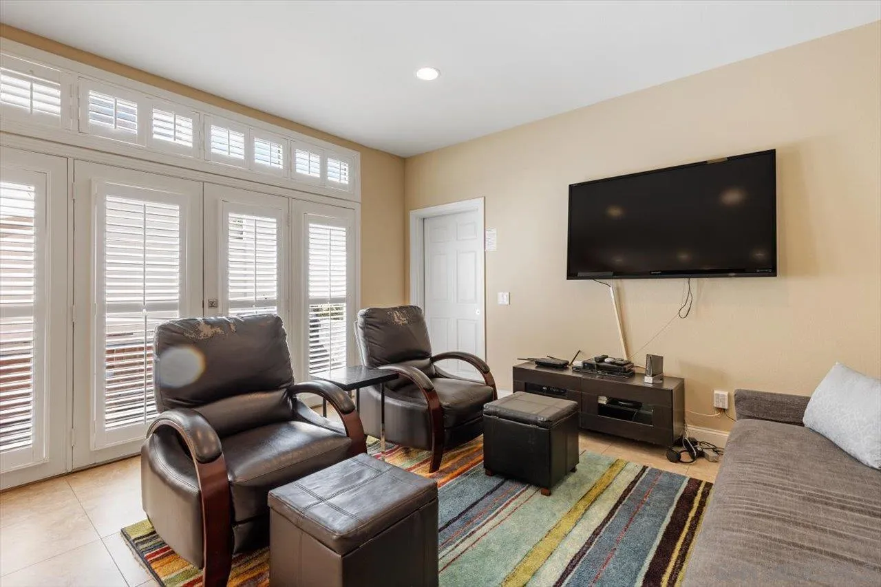 312 Bonair Street La Jolla, CA 92037 - Photo 8 of 40 a living room with furniture and a flat screen tv