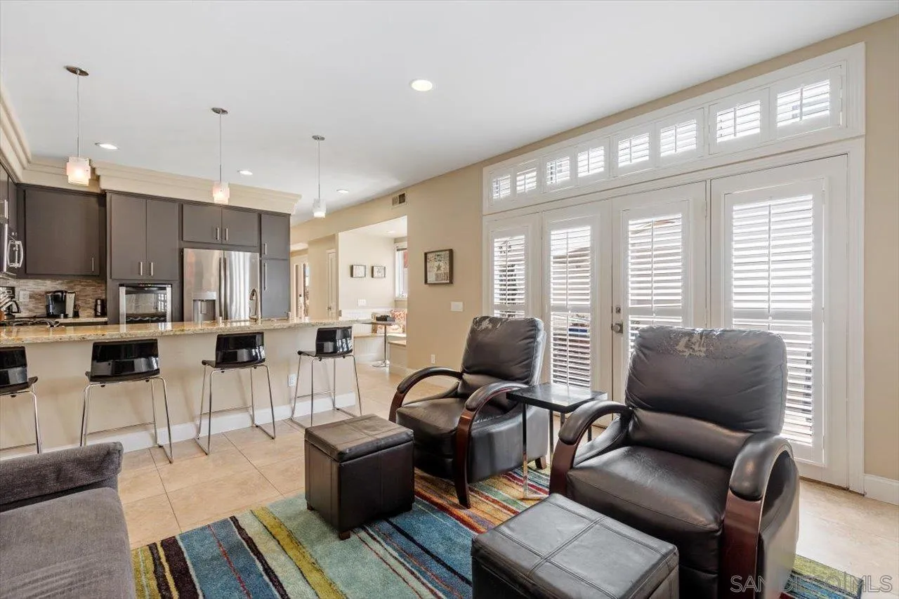 312 Bonair Street La Jolla, CA 92037 - Photo 9 of 40 a living room with furniture and a large window